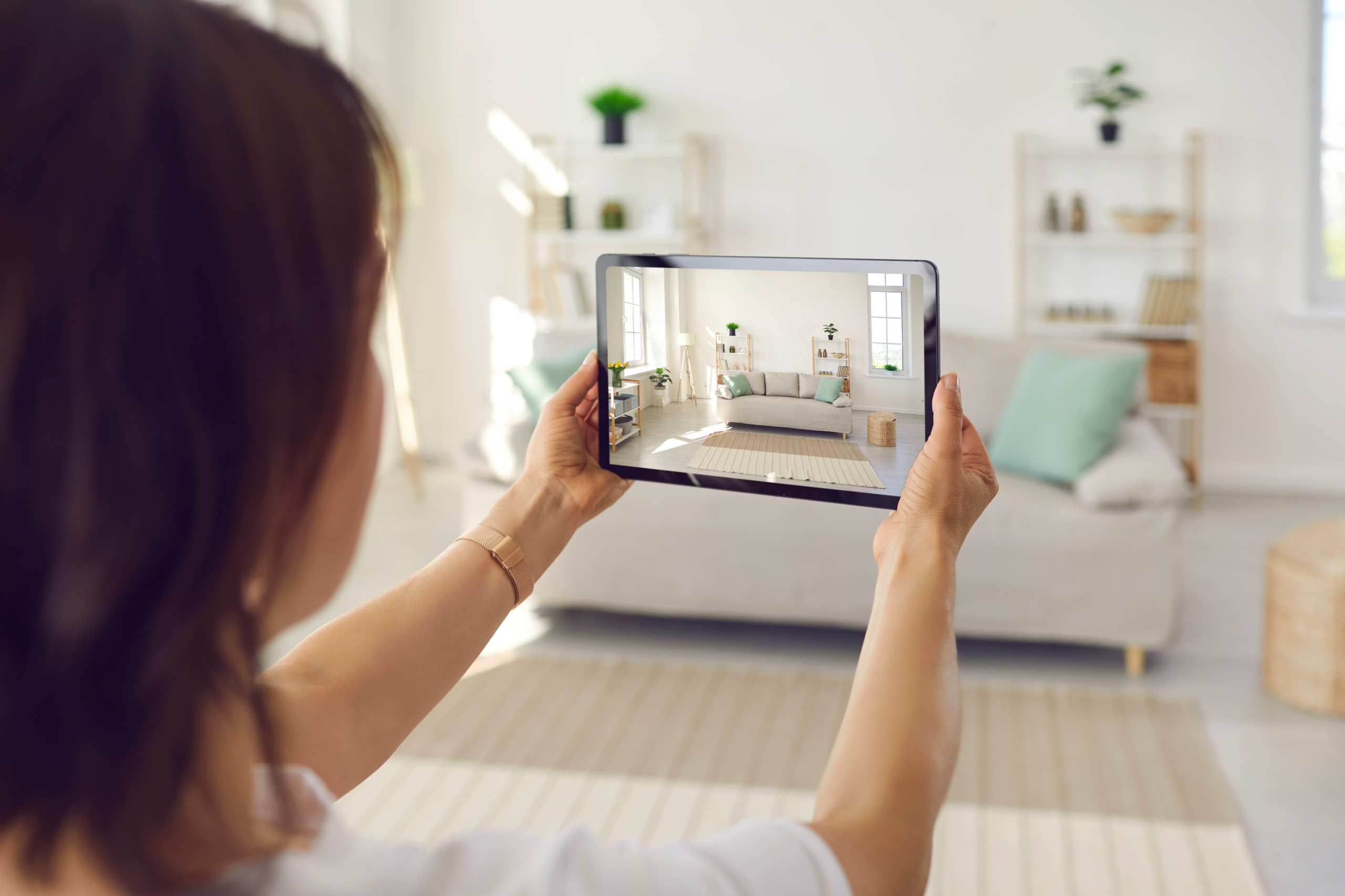 woman taking photo of home
